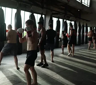 Boxing training Bali participants working on combinations inside Surya Gym studio.