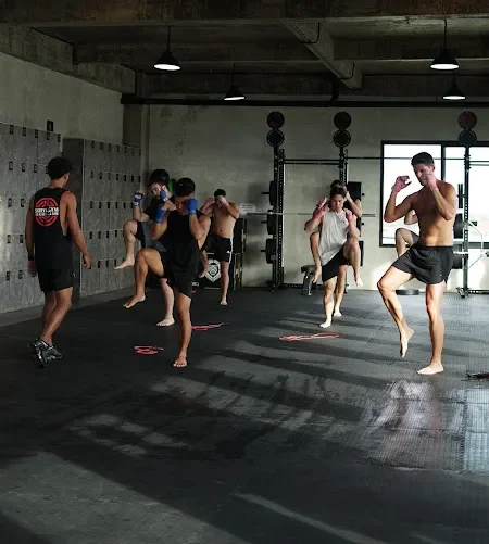 Participants warming up for fight club classes in Bali inside Surya Gym’s open studio.