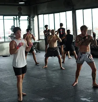 Hands-on boxing drills happening inside Surya Gym during fight club classes in Bali.