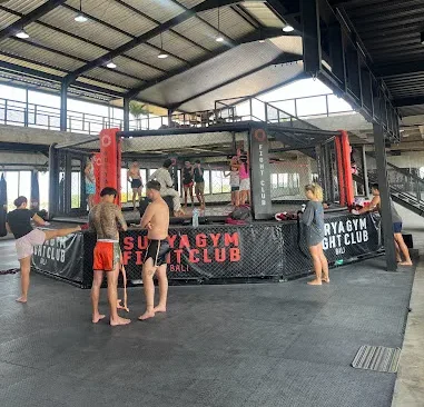 Surya Gym boxing ring area filled with participants practicing fight club classes in Bali.